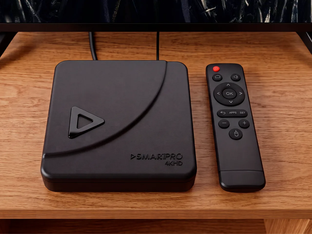 Aparelho Velloz TV e controle remoto sobre a mesa